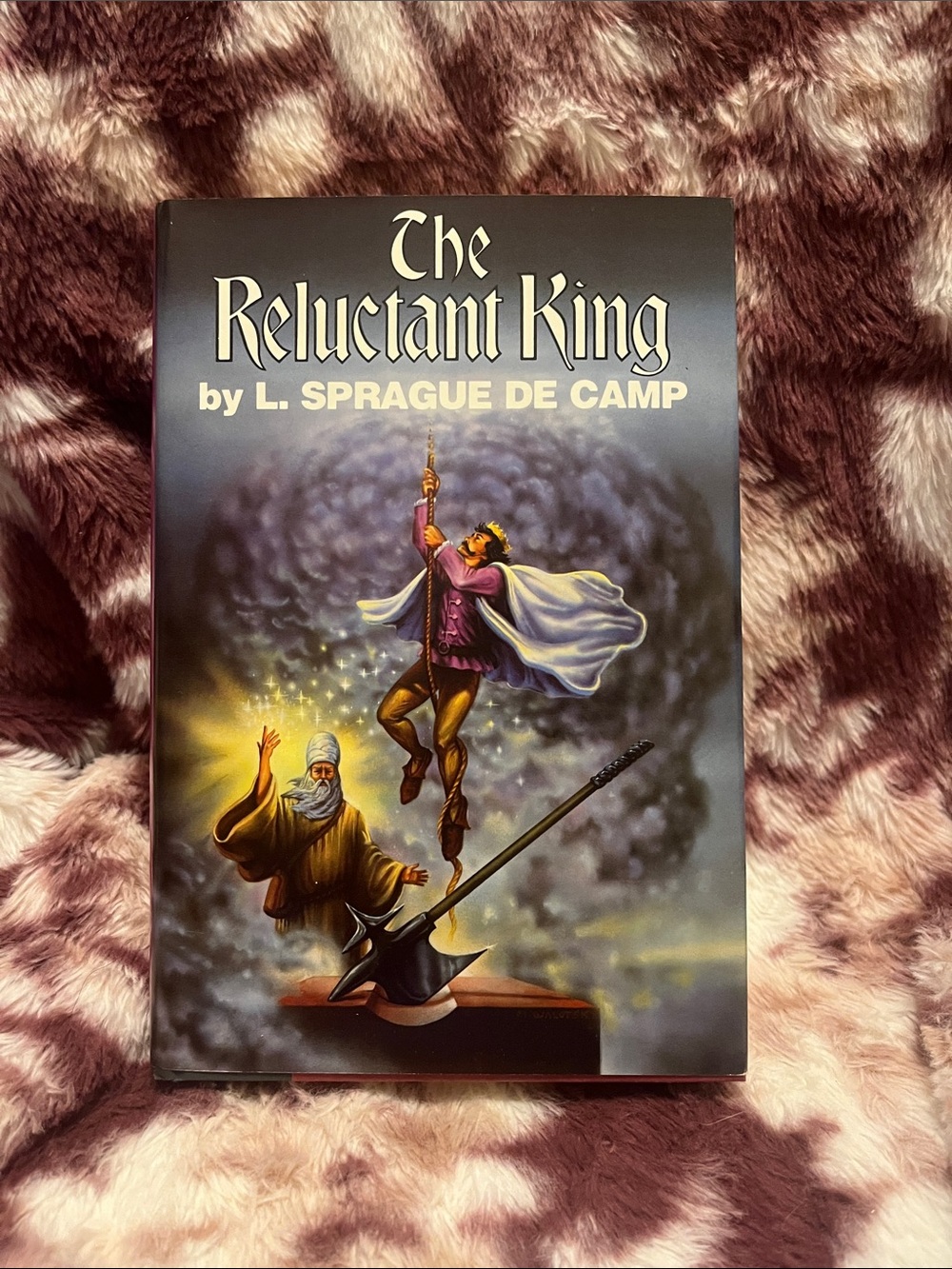 The Reluctant King trilogy by L. Sprague De Camp
